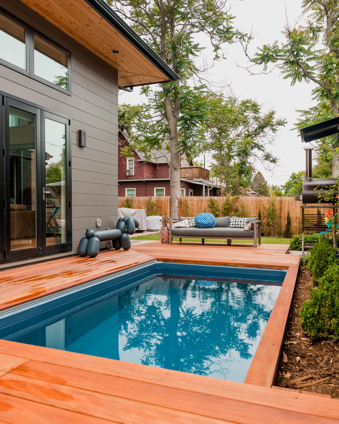 Homeowner enjoying a backyard plunge pool