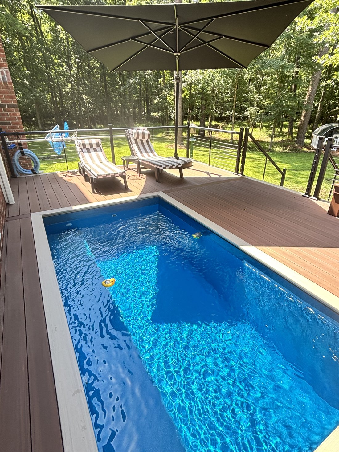 Customized fiberglass pool with deck