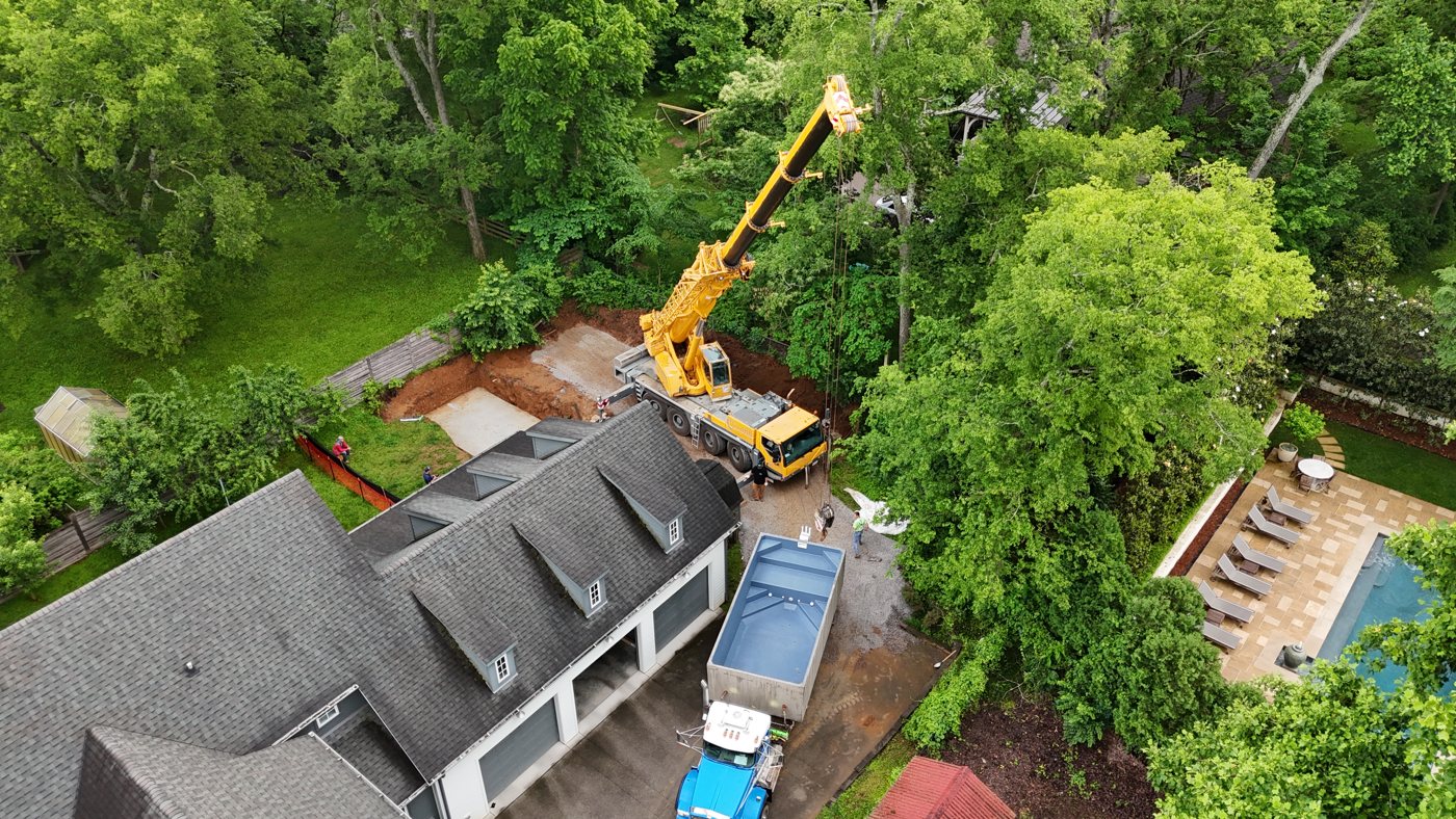 Crane setting a precast pool